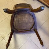 Chair with caned seat and back made of wood