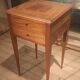 Nightstand with veneer and 4 drawers.