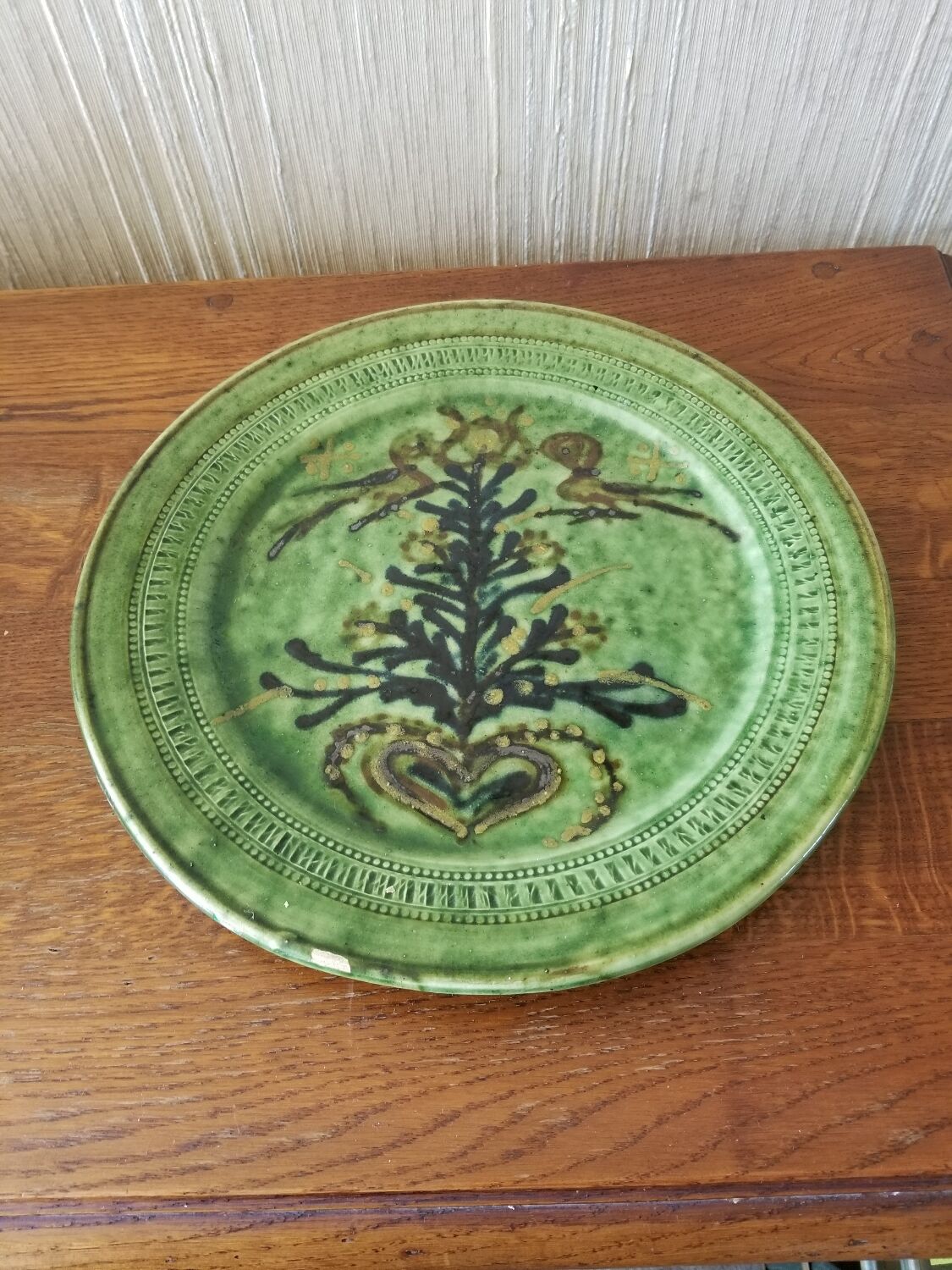 Green earth dish with a pattern from the manufacture Saint Jorioz Annecy