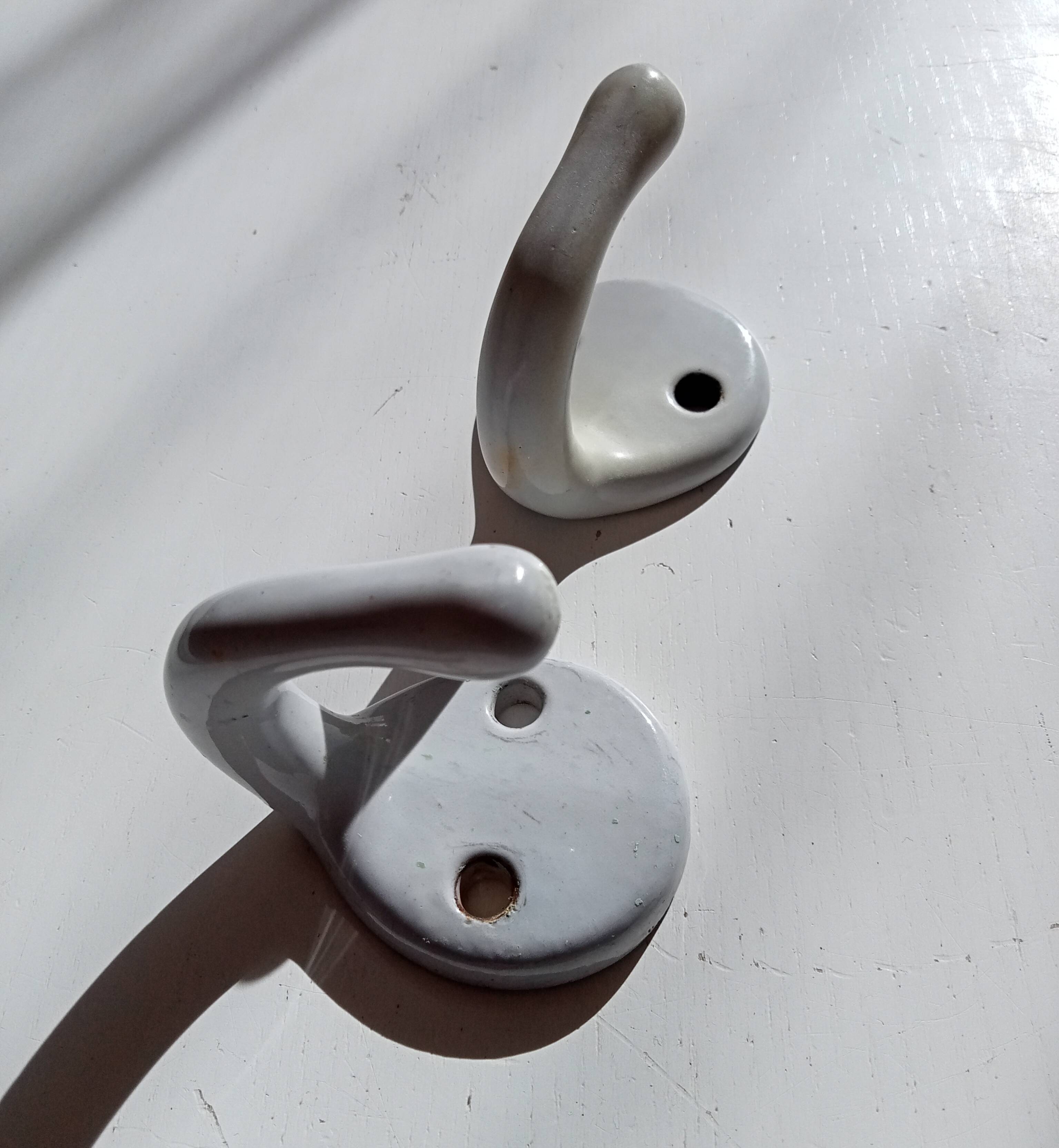 Antique enamelled cast iron wall hook from the 30s/40s