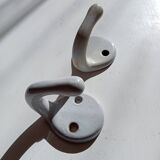 Antique enamelled cast iron wall hook from the 30s/40s