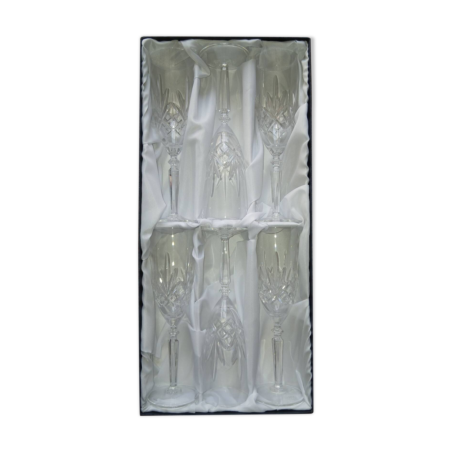6 crystal champagne flutes from Lorraine Walsheid in their case.