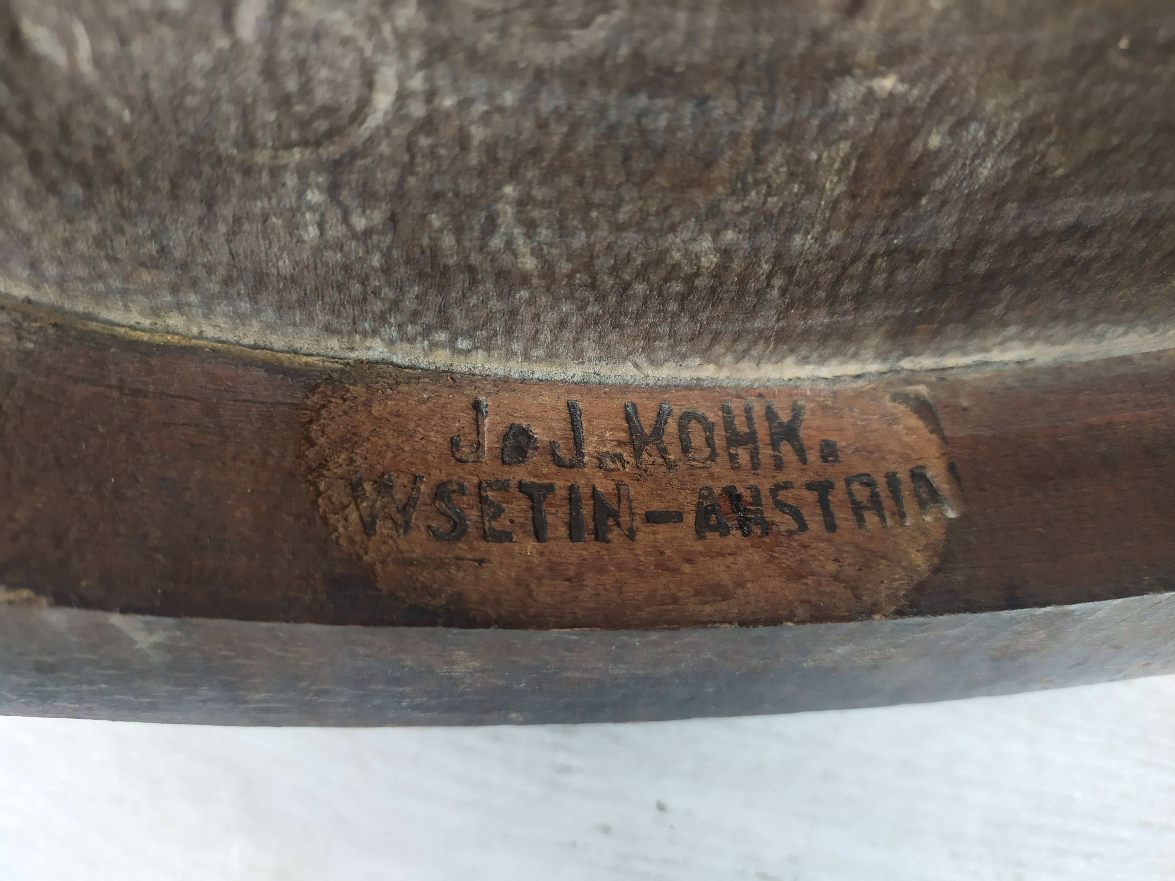 Kohn curved wooden armchair