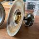 Pair of industrial brass wall lamps