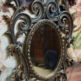 Antique Louis XV style mirror, richly carved with scrollwork, shells, and foliage.