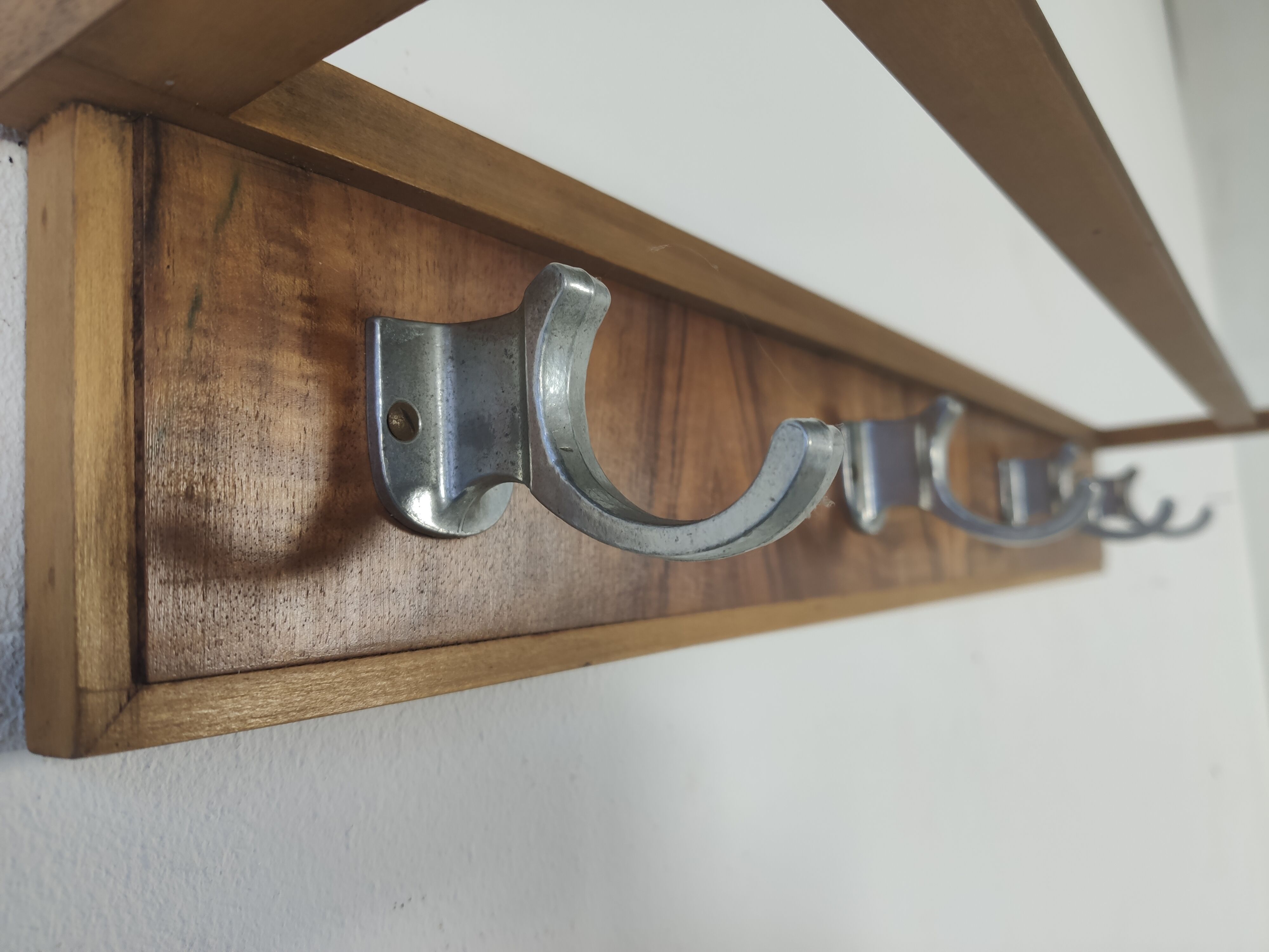 Walnut and metal wall coat rack, 1950s