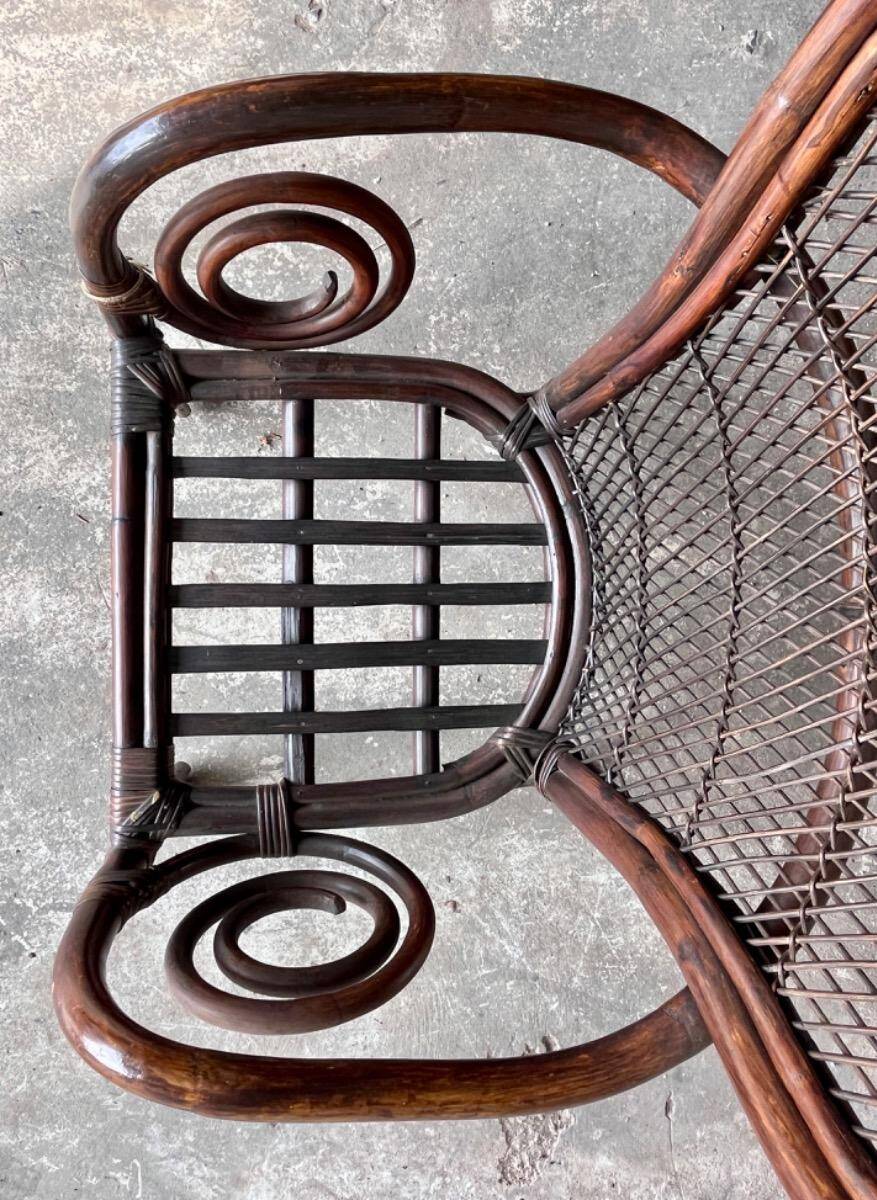 Mid-century Manou dark brown bamboo armchair with open rattan backrest, 1960s French