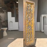 Rectangular Indonesian construction element with blue and yellow plant in carved wood