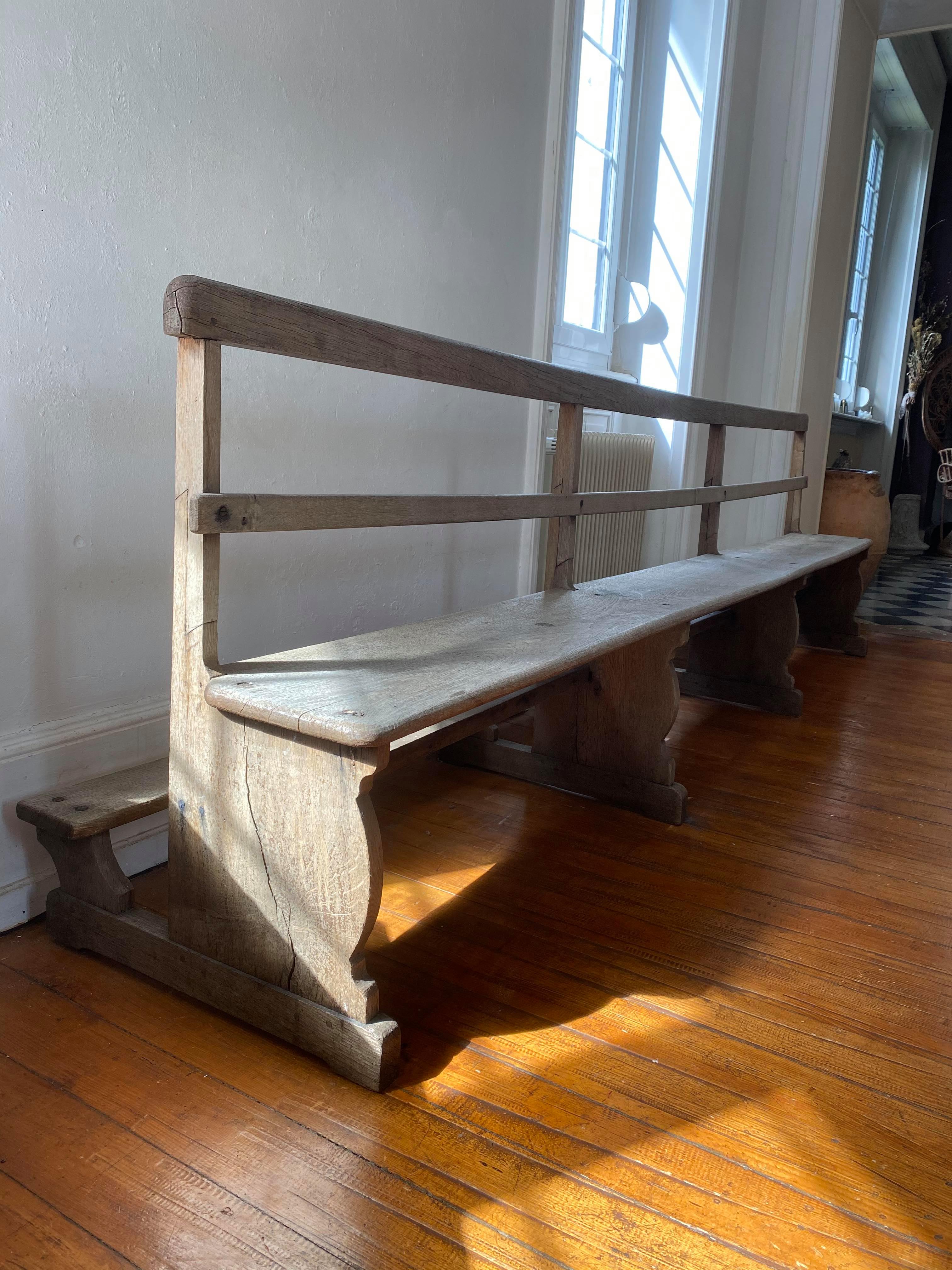 Very large church bench in patinated raw oak