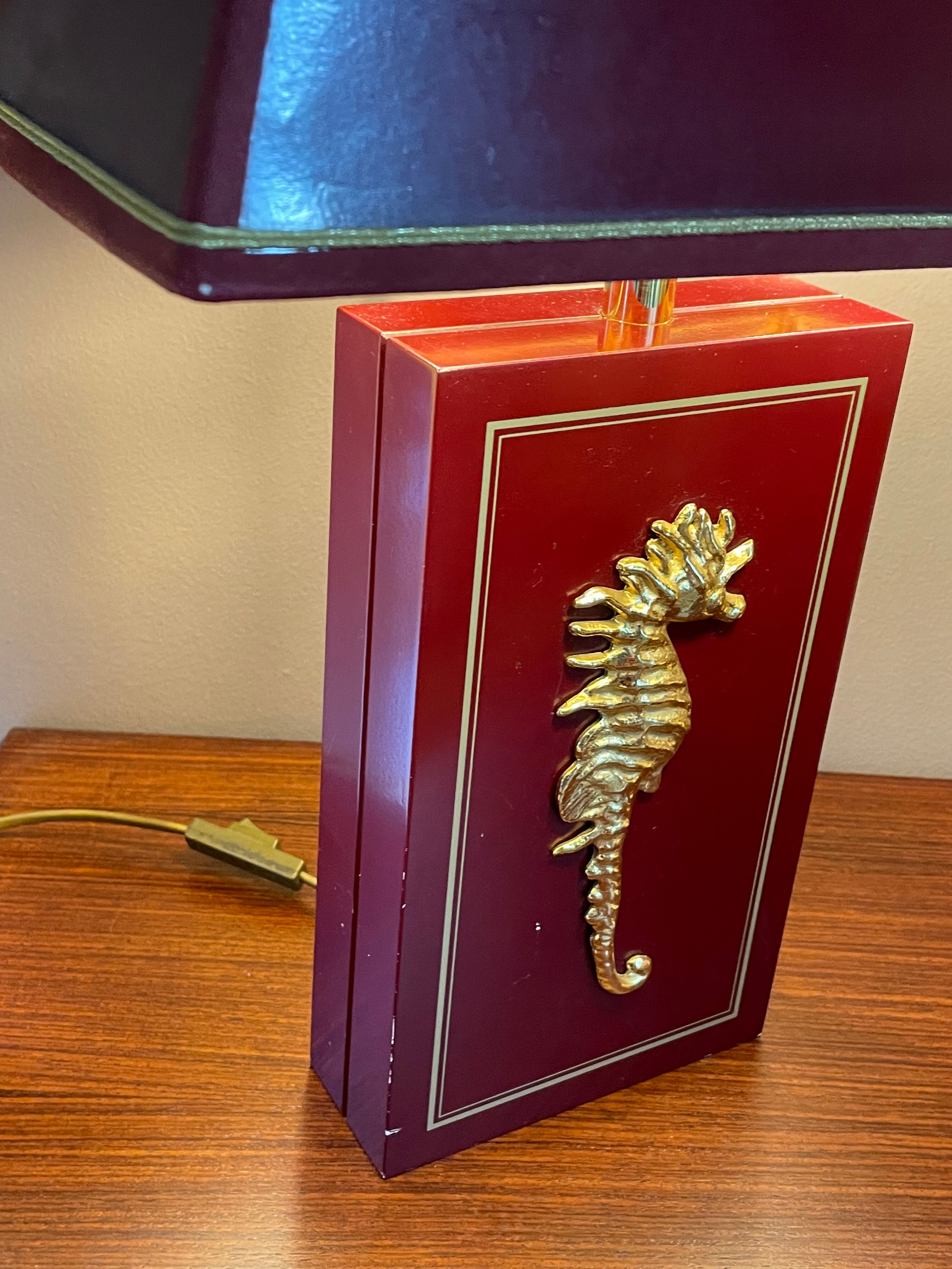 Pair of table lamps in Bordeaux lacquered wood and brass seahorse