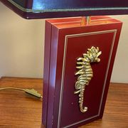 Pair of table lamps in Bordeaux lacquered wood and brass seahorse