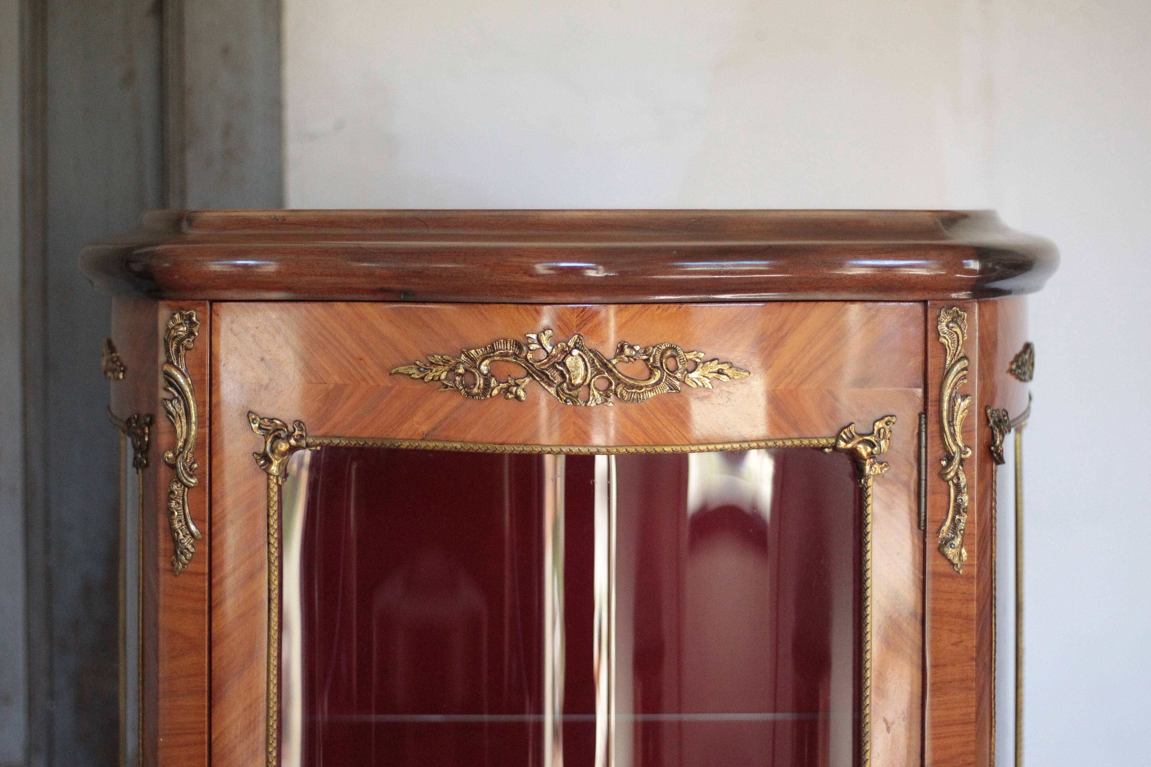 Marquetry display cabinet, curved Louis XV style, signed Marquant