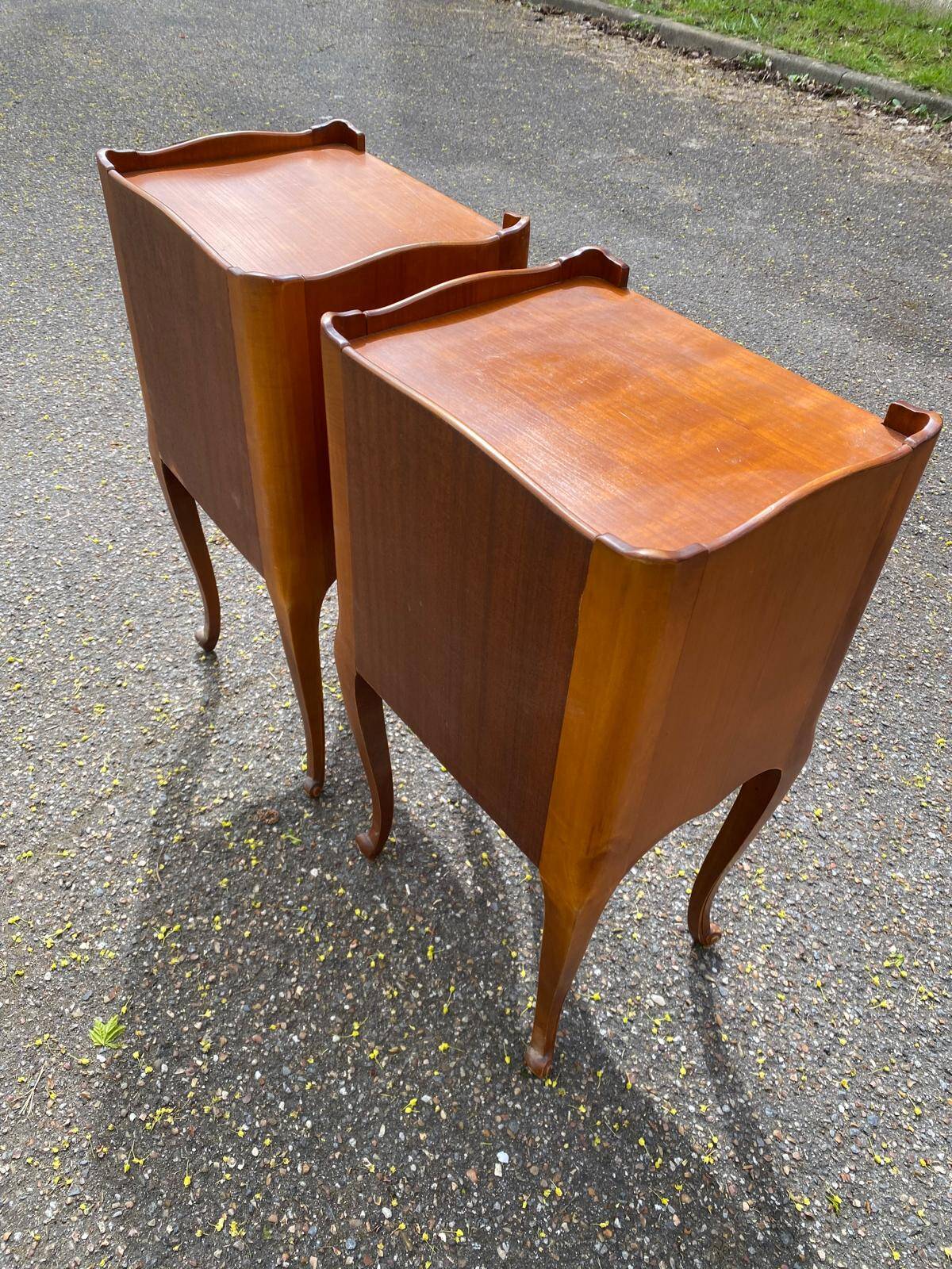 2 Louis XV bedside tables made of curved solid wood with drawers.