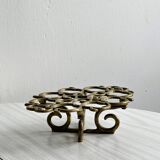 Brass trivet with openwork pattern in the shape of apples.