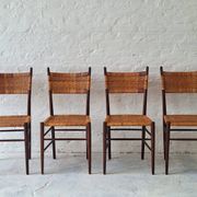 Four teak dining chairs with patinated cane after Gio Ponti, Italy 1960s