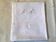 Square linen tablecloth marked RA