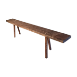 Old rough bench made of solid wood