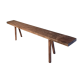 Old rough bench made of solid wood
