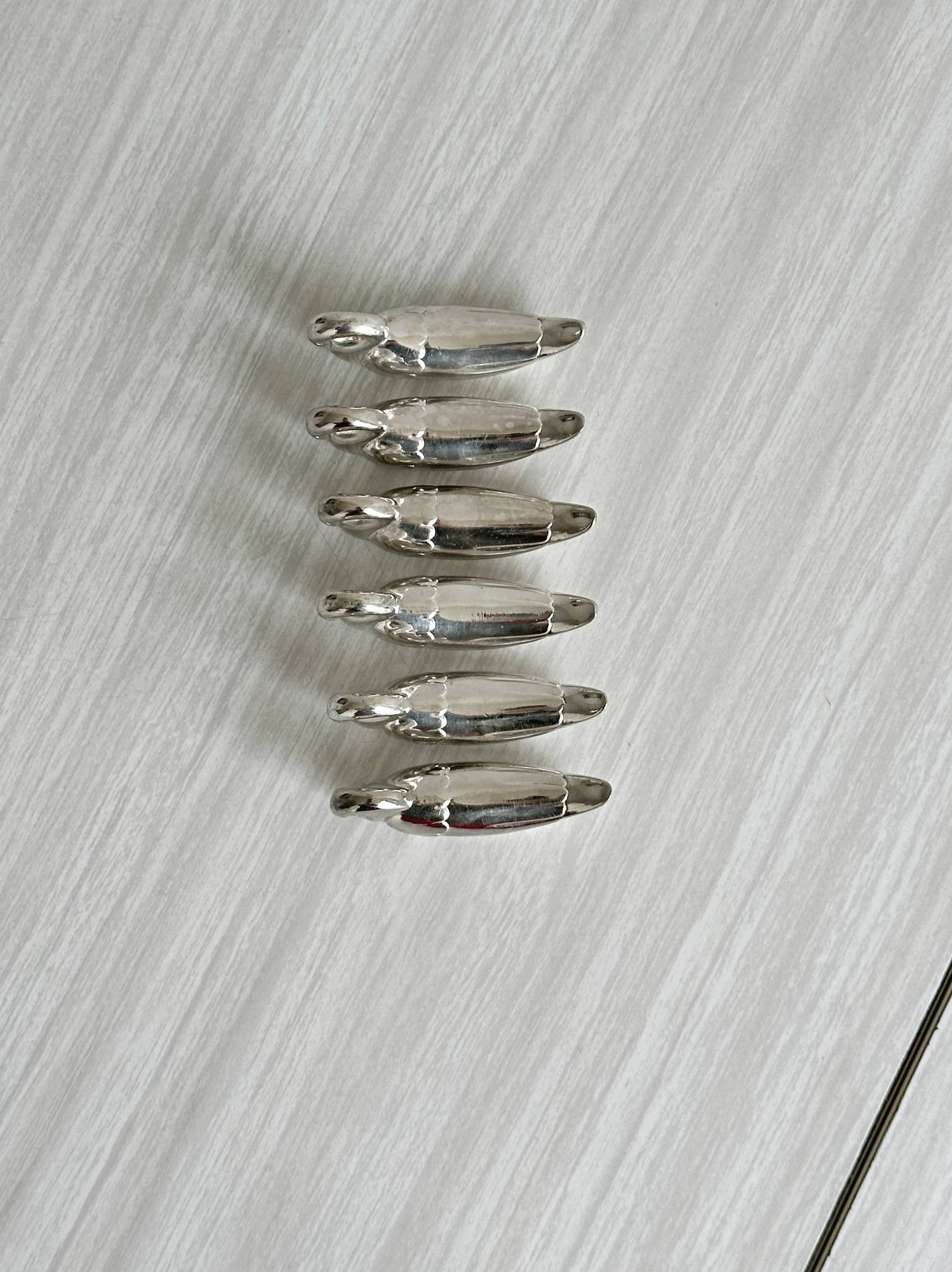 set of 6 metal knife holders in the shape of a swan,