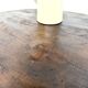 Brutalist coffee table in solid teak, monolithic slab, tripod base.