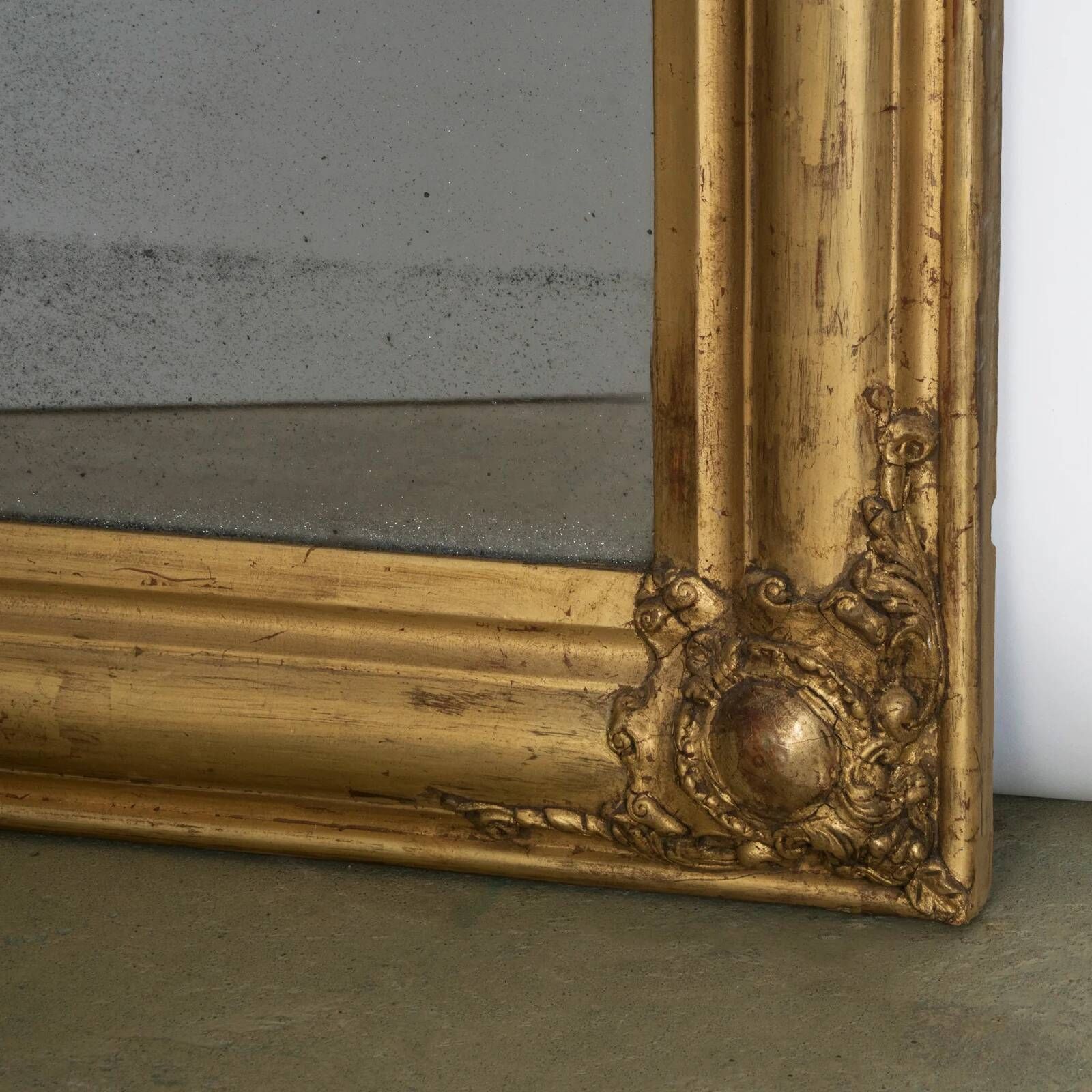 Louis-Philippe mirror from the 19th century with foliage and grape cluster motifs.