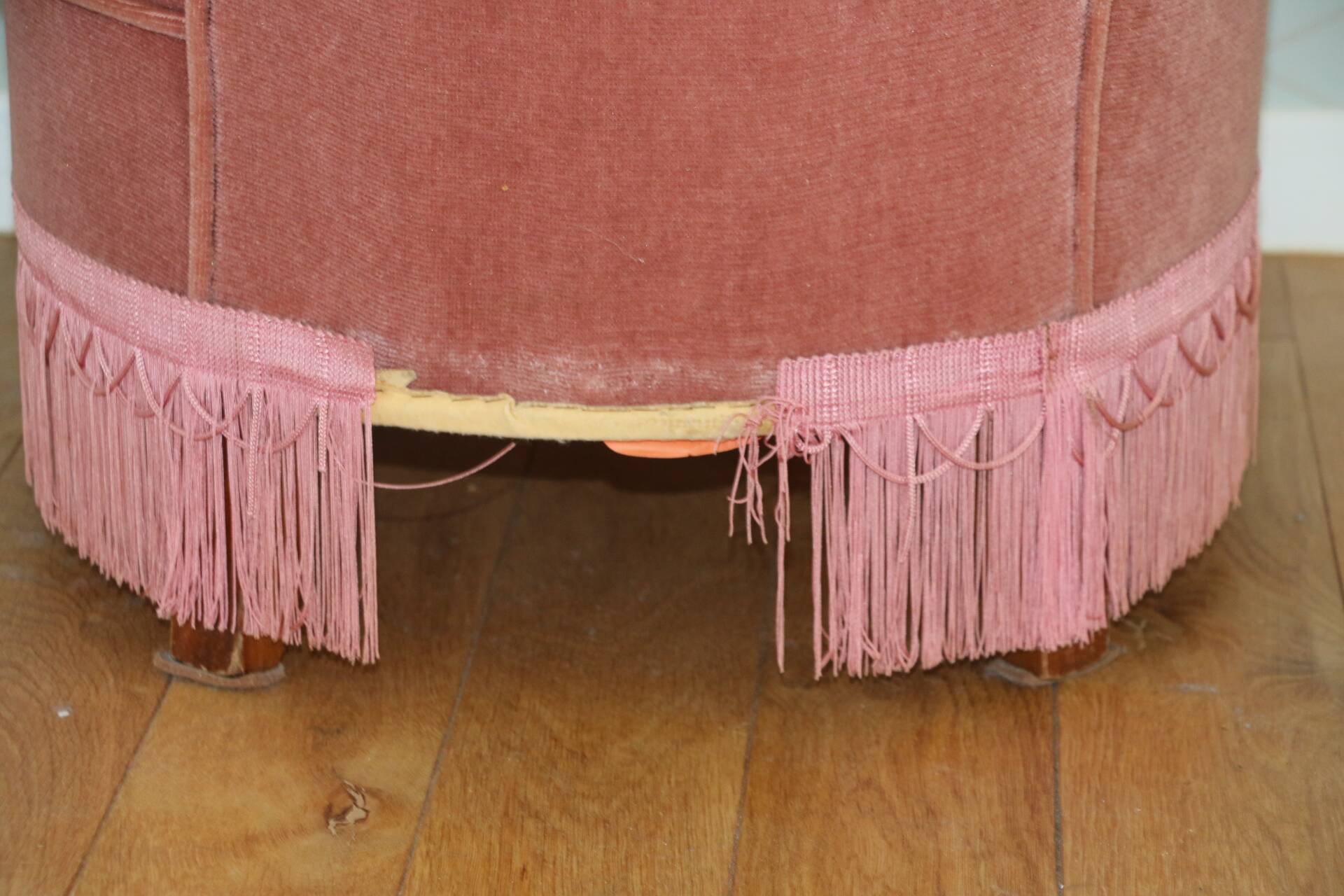Powder pink fireside chair with fringes