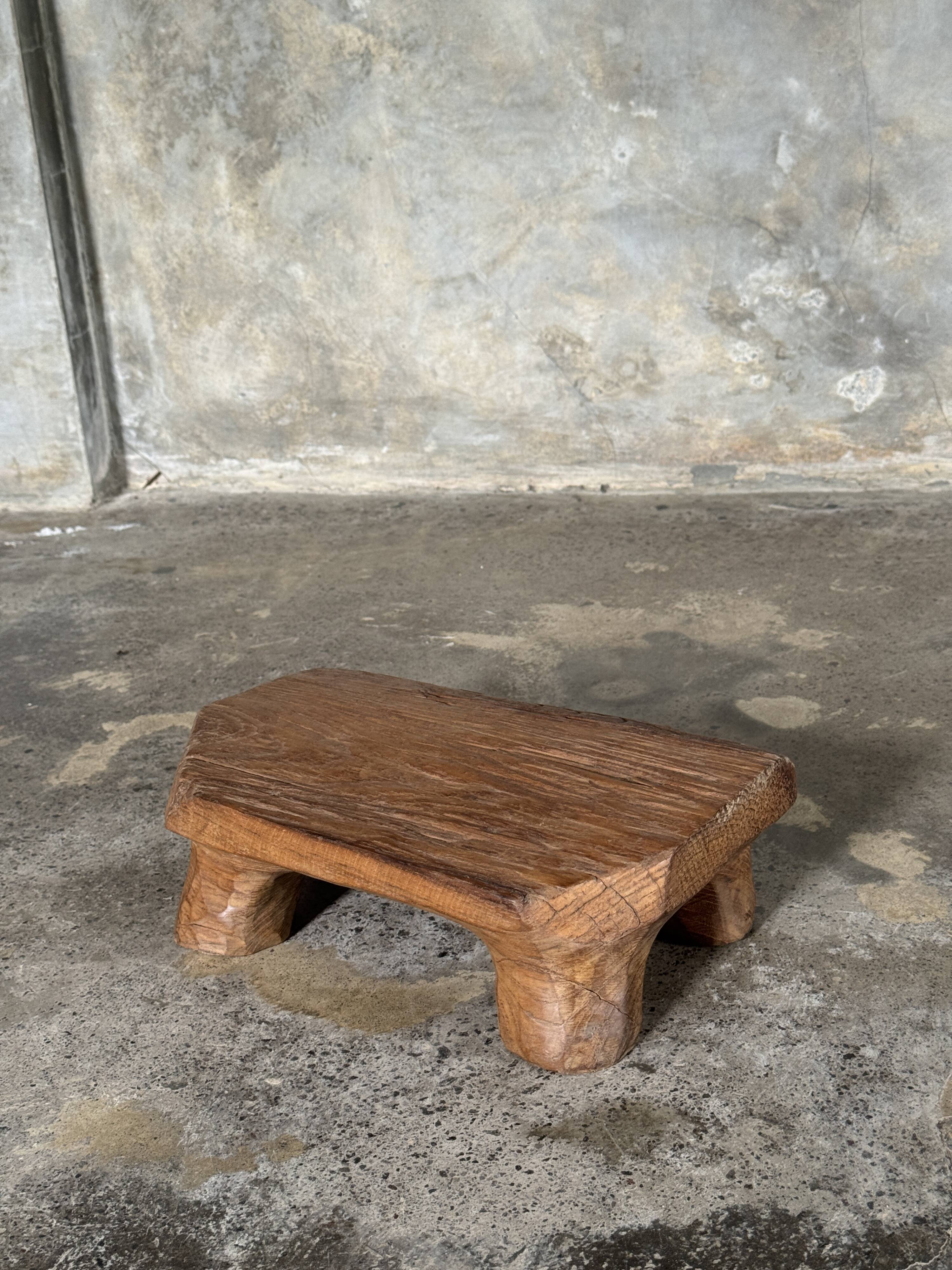 Small stool, teak footrest with short cut corners.