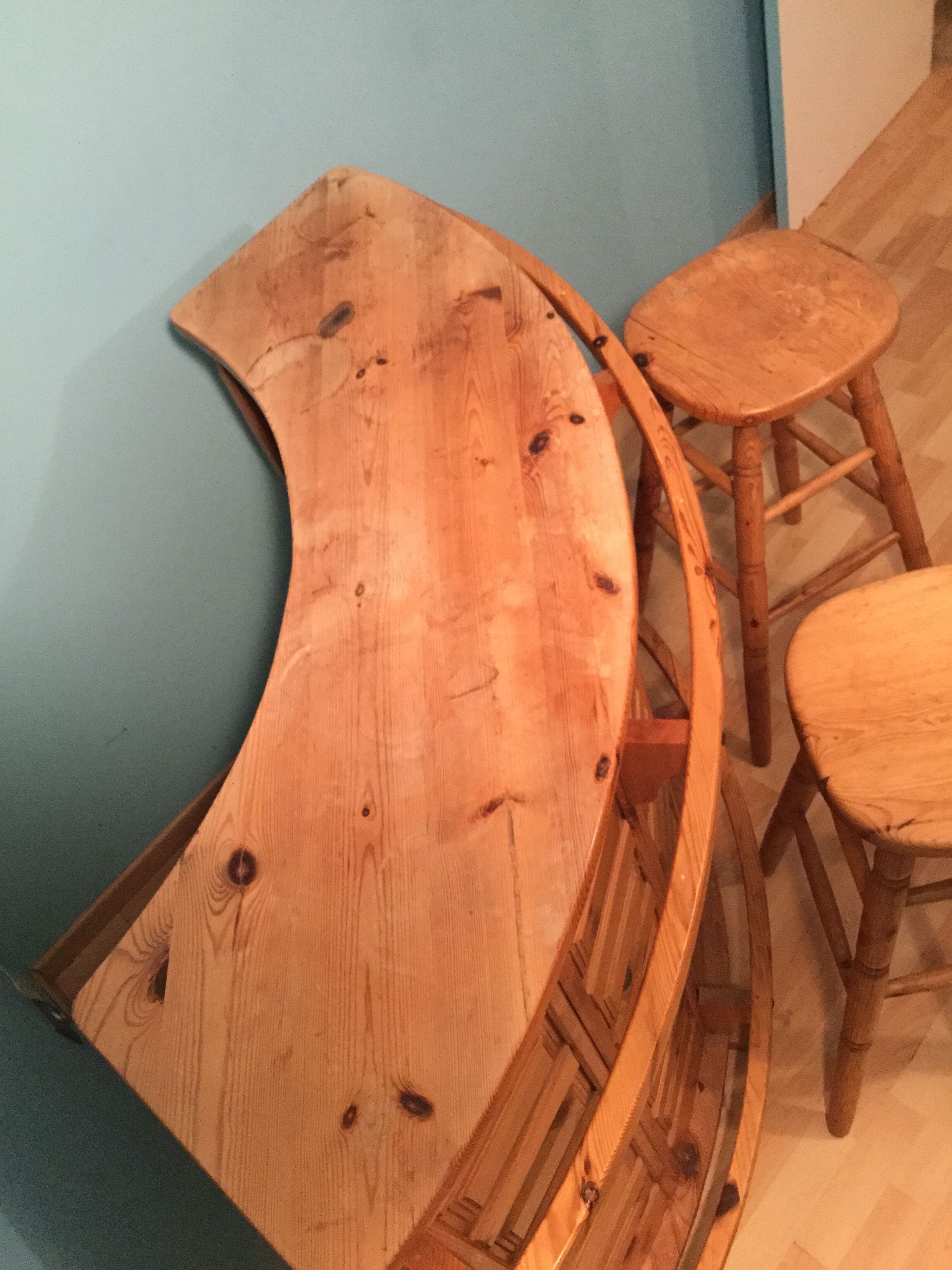 Vintage bar counter with natural wood stools