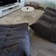 Togo 3-seater sofa by ligne roset with an ottoman.