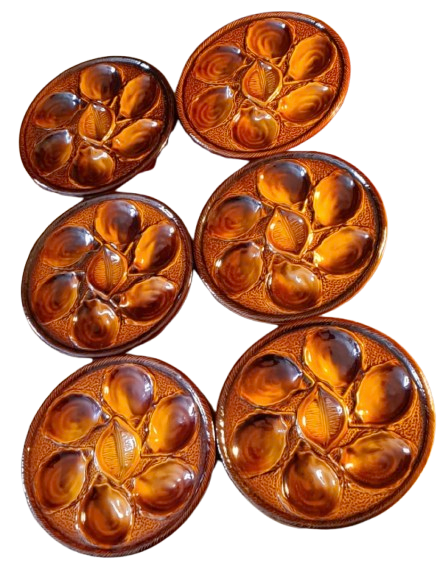 Six oyster plates signed Saint Clément