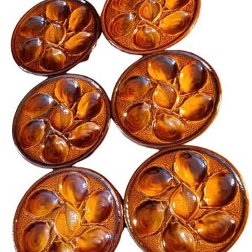 Six oyster plates signed Saint Clément