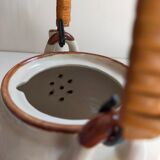 Flowered stoneware teapot with vintage rattan handle