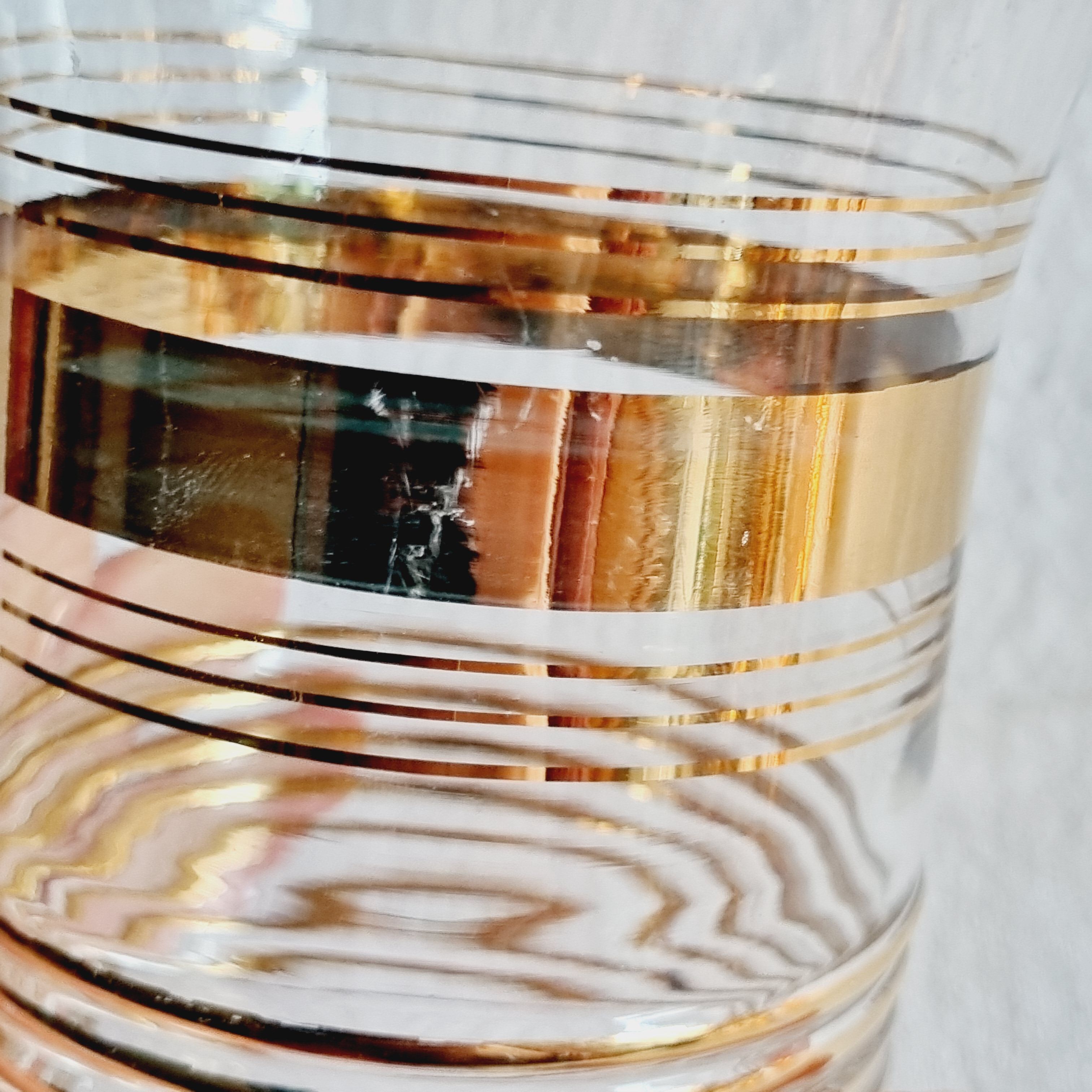 Blown glass decanter with golden borders