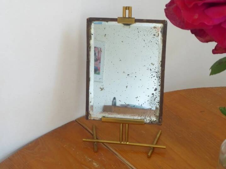 Table mirror on a brass easel