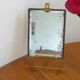 Table mirror on a brass easel