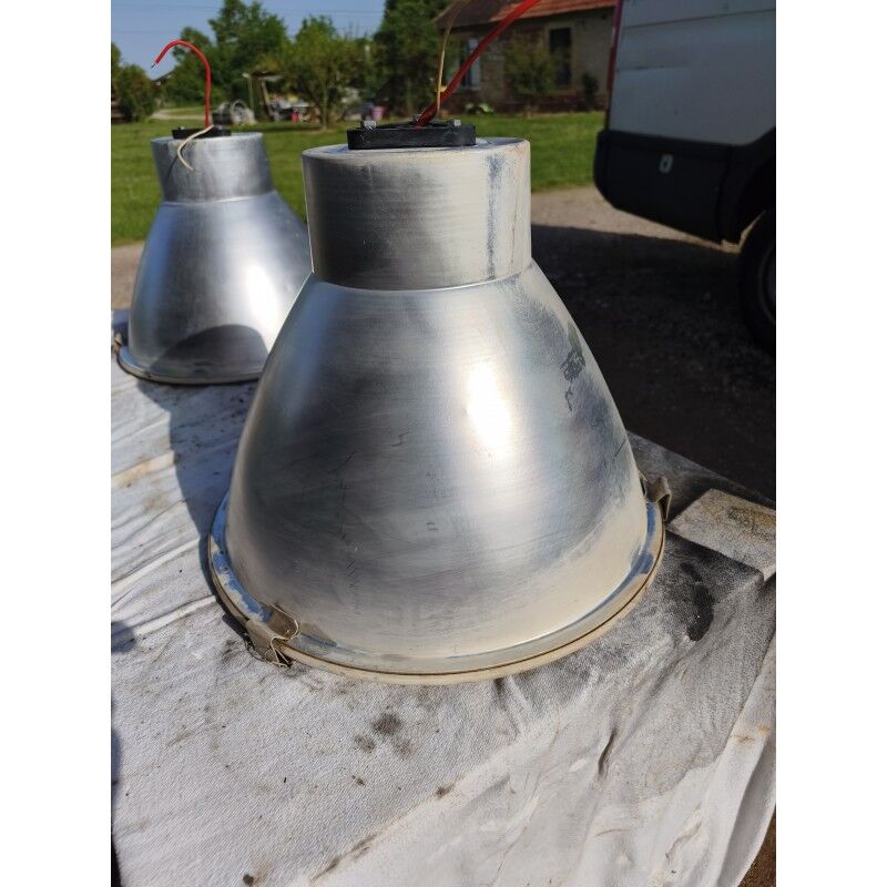 Pair of industrial pendant lights in aluminium and glass.