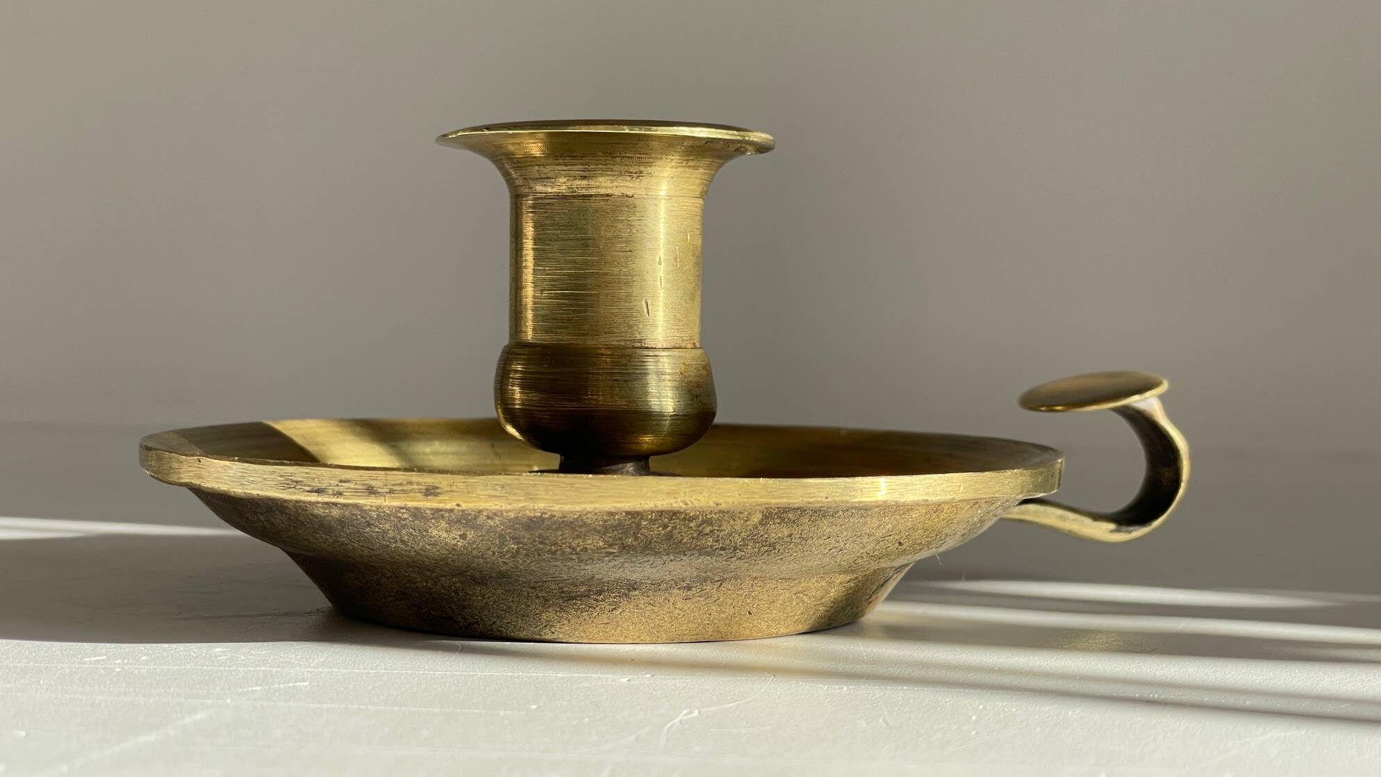 Antique solid bronze hand candlestick