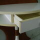 White lasked wood console and 1980s skai background