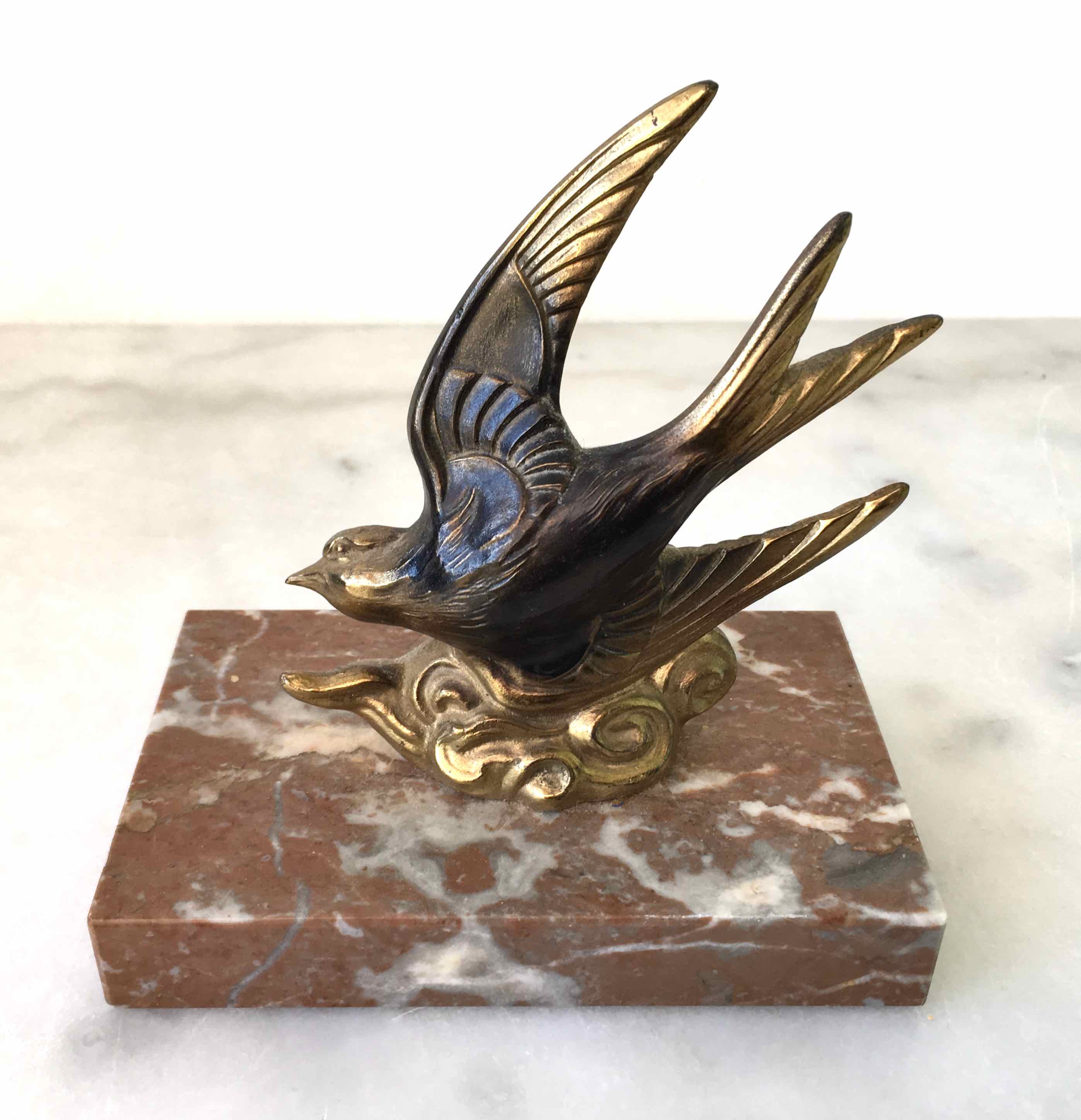 Marble swallow and brass paperweight