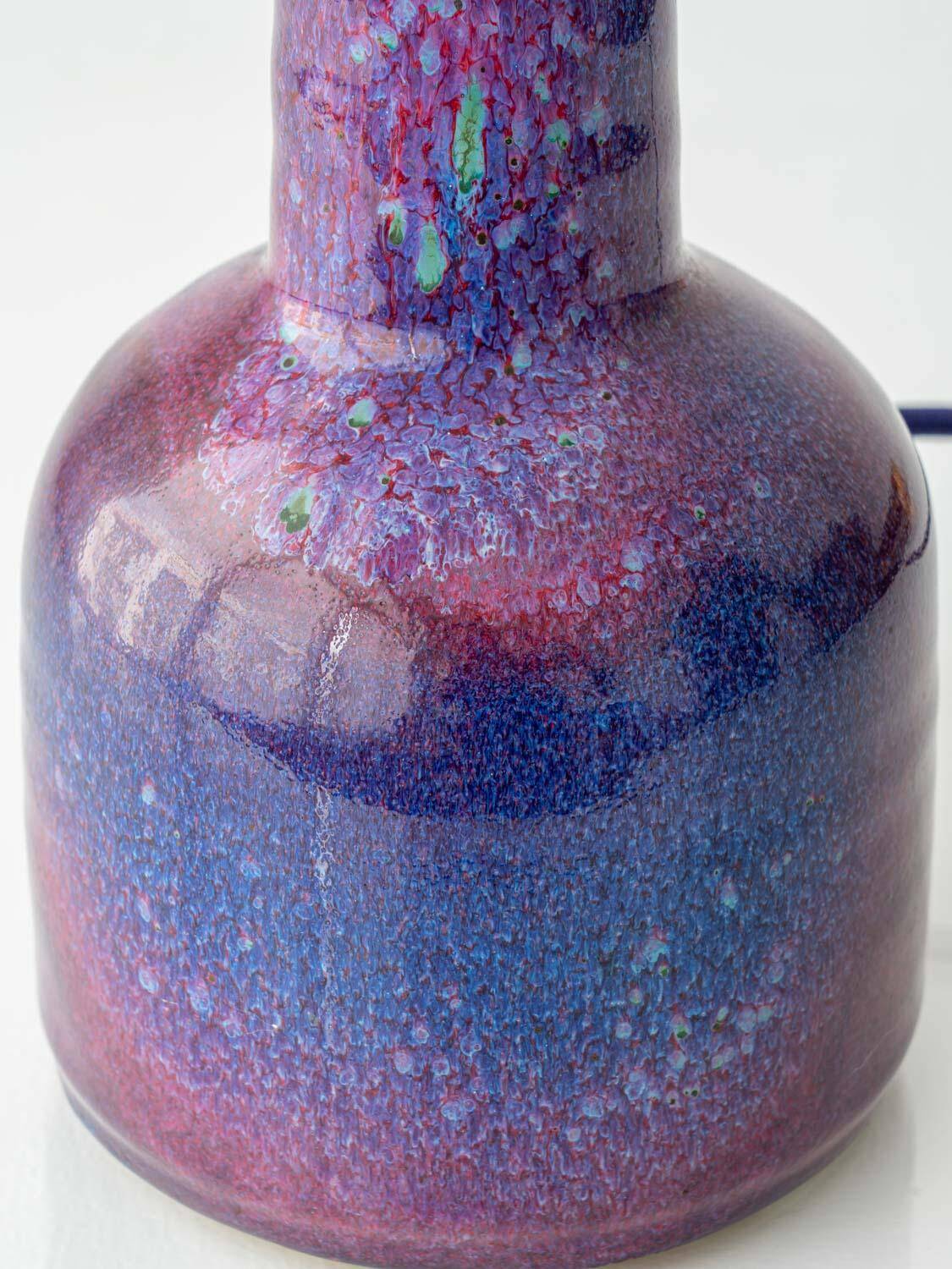 Mid-century modern table lamp by Jaap Ravelli, ceramic base and glass shade.