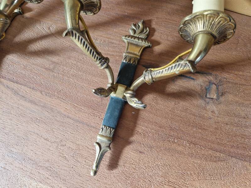 Pair of Empire-style wall sconces in gilded bronze and green lacquer.