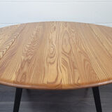 Ercol round drop leaf dining table - black leg, 1960