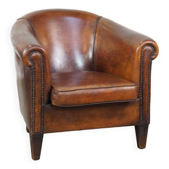 Fauteuil club en cuir de mouton vintage couleur cognac