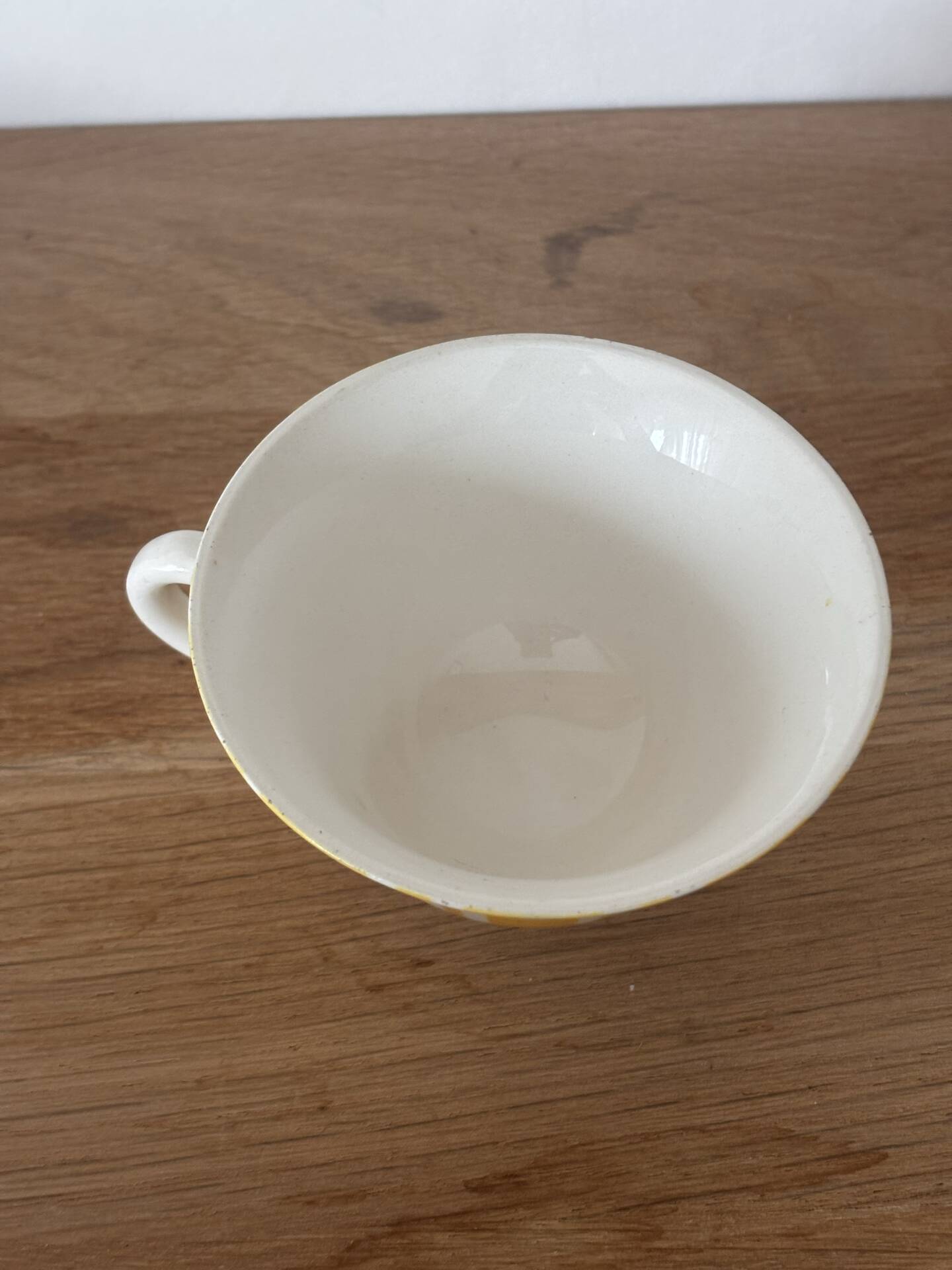 Set of two antique yellow Digoin Sarreguemines cups.