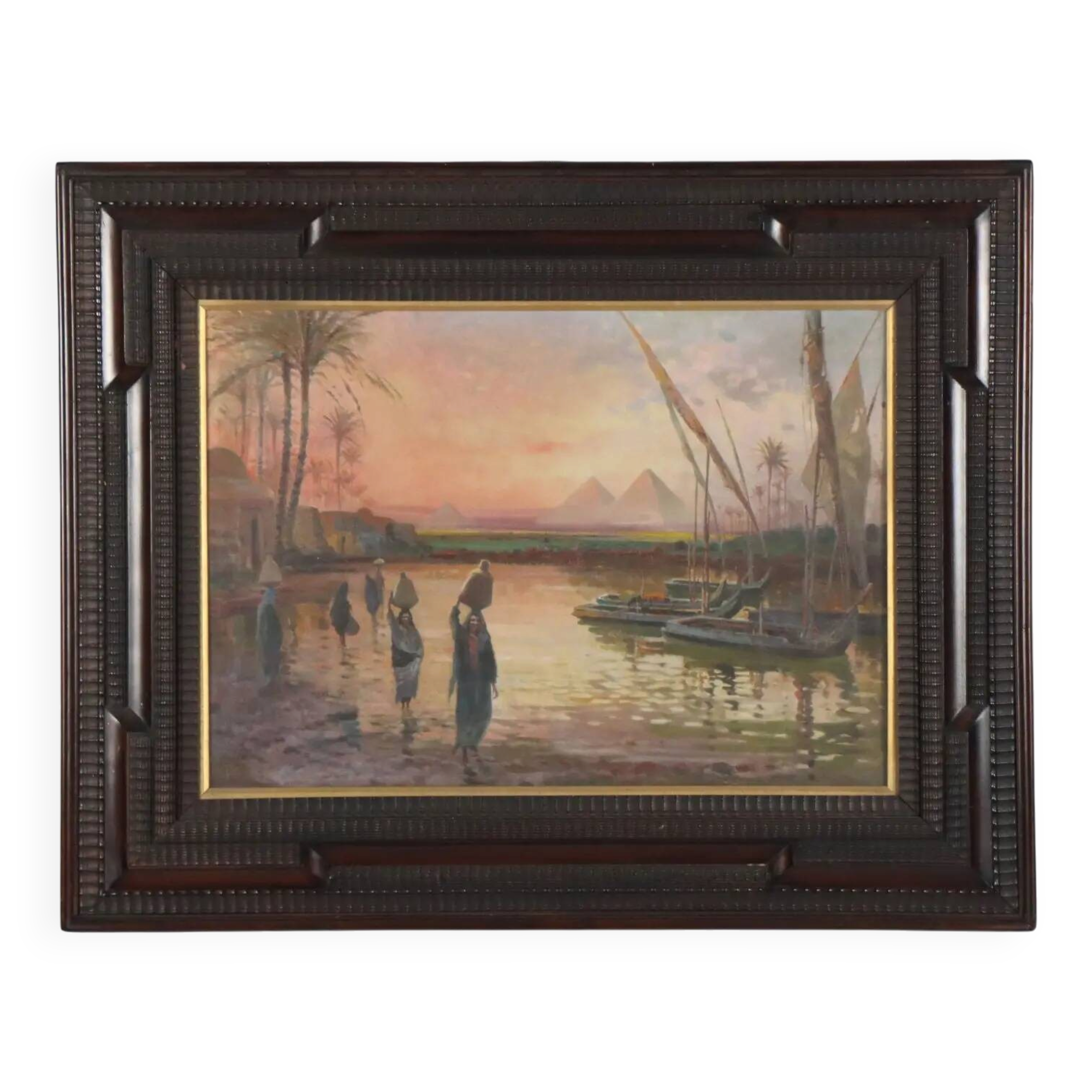 Ancient painting of an exotic landscape with pyramids and figures from the 1800s.