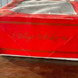 The service of 6 whiskey glasses with red flowers, with its bucket and its ice cube tongs.
