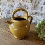 Jug or chevrette in yellow glazed stoneware