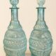 Pair of cut blown glass carafes in blue-green from the 19th century.
