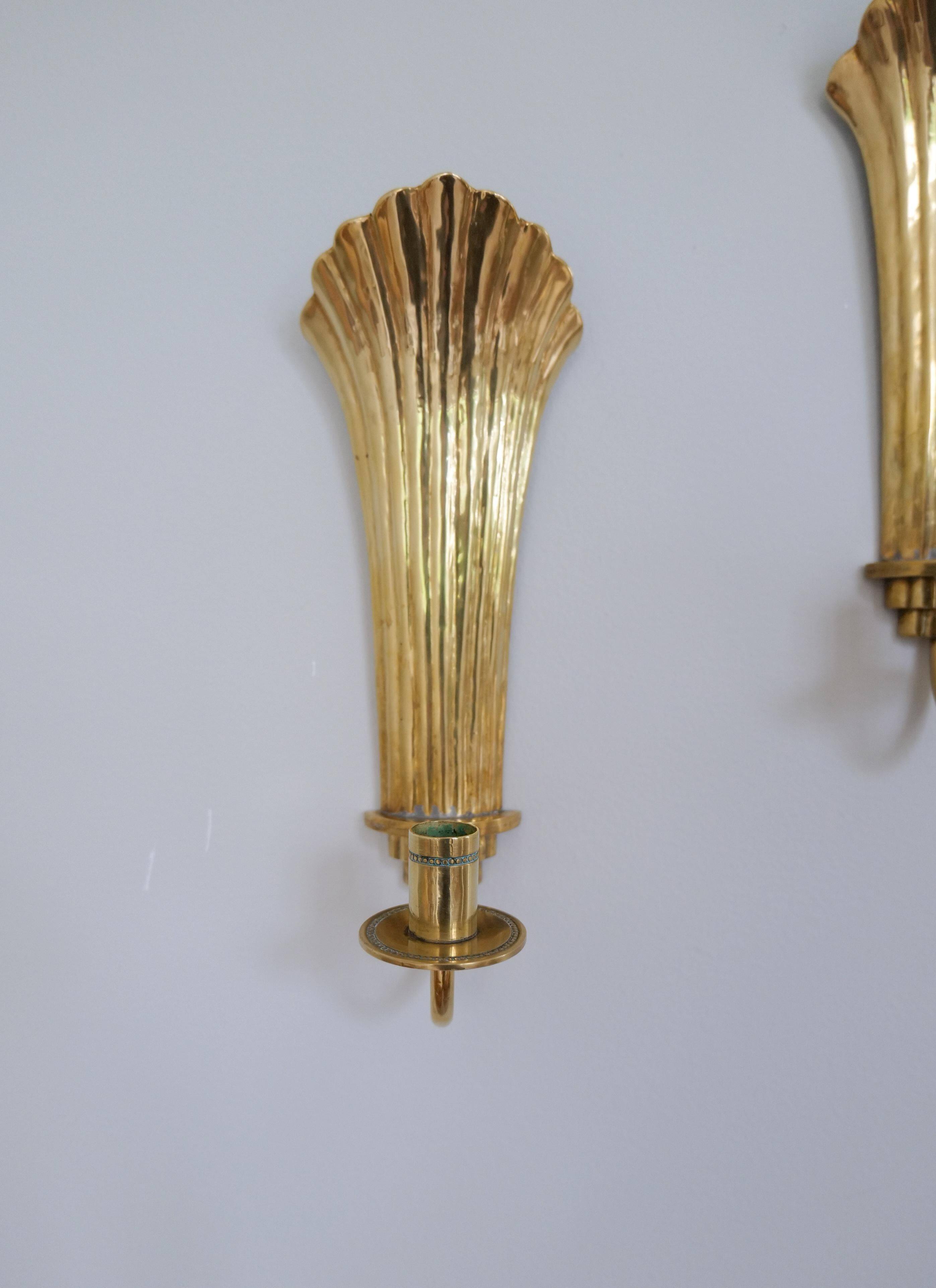 Pair of Art Deco brass wall sconces by Holmström, Arvika, Sweden, 1940s.