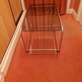 Coffee table with wheels and its two shelves give a smoked